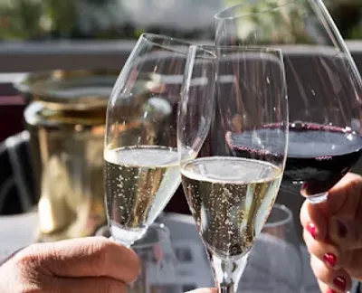 A festive dinner toast — the kind of small team Christmas dinner this case study's poll organized